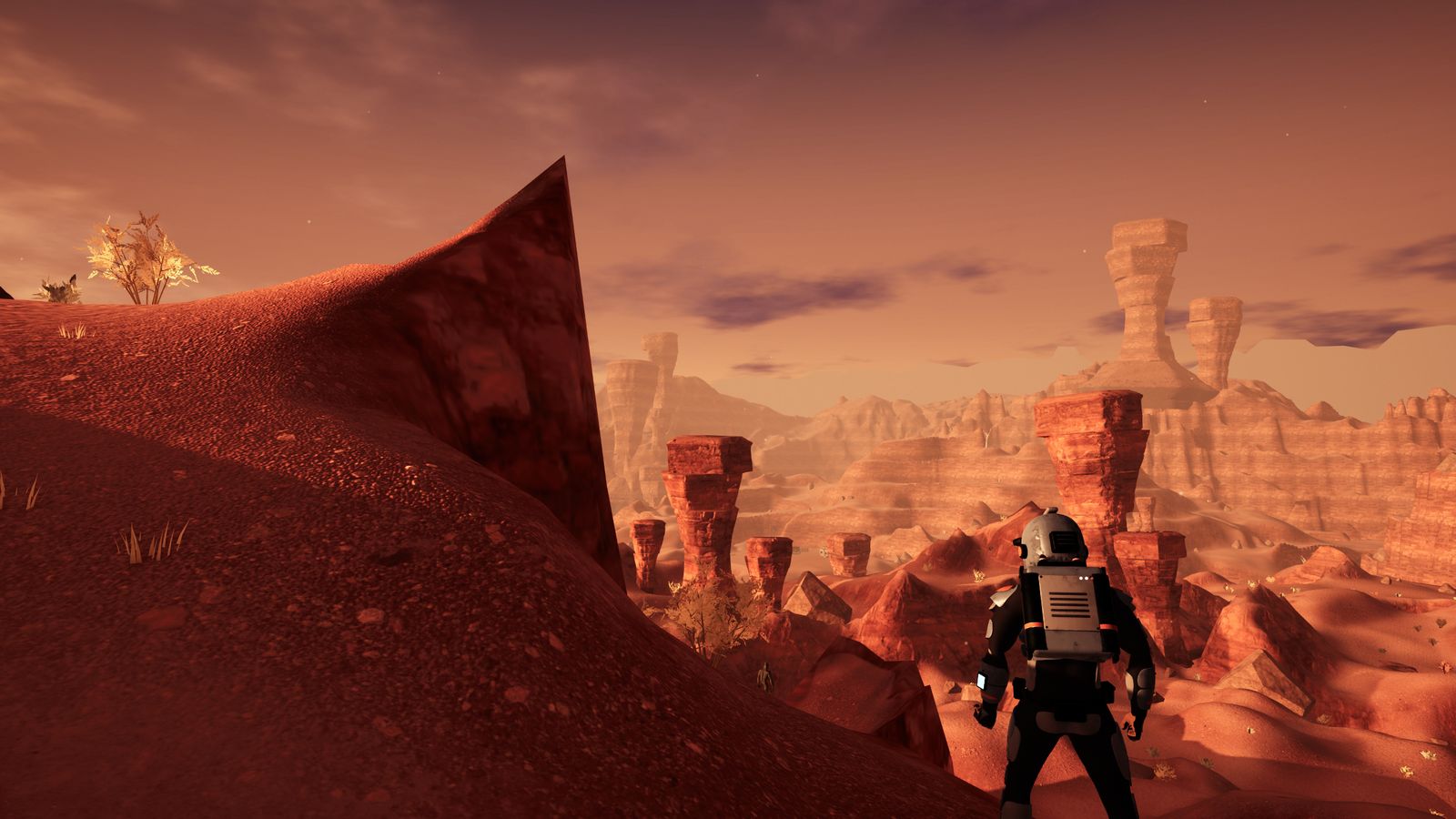 Ashur: un astronauta mira el cañón de agujas de roca del desierto rojo